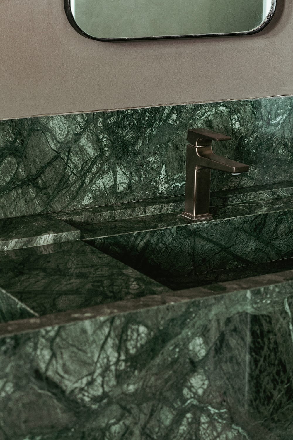 Canggu Villa Brushed Brass Hansgrohe tap on Custom Marble Sink